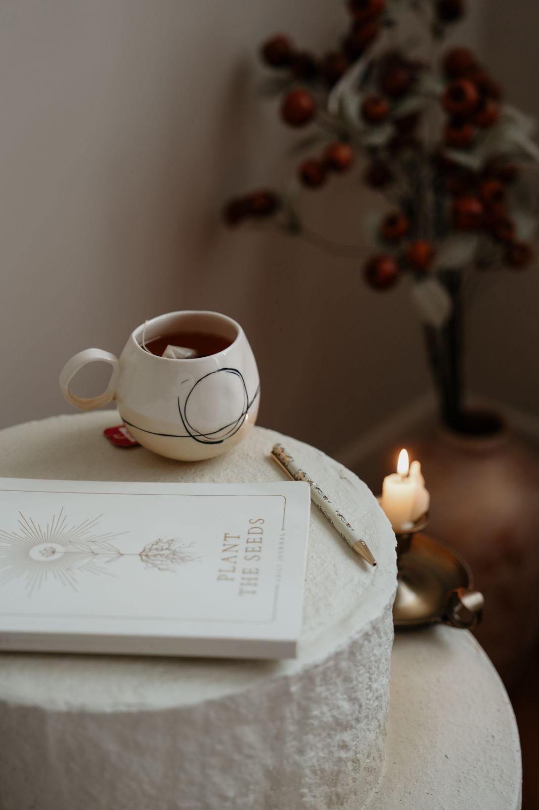Journal with tea and candle